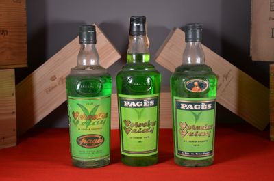 three bottles of alcohol are sitting on a red table