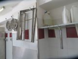 a picture of a kitchen with a lot of pots and pans hanging on the wall