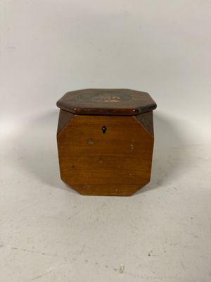 an old wooden box sitting on a white surface with a white background