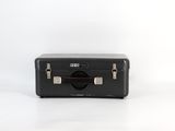 a black suitcase sitting on top of a white table