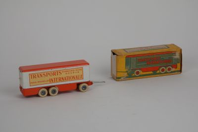 two toy trucks that are sitting next to each other