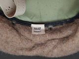 a close up of a hat with a tag on it