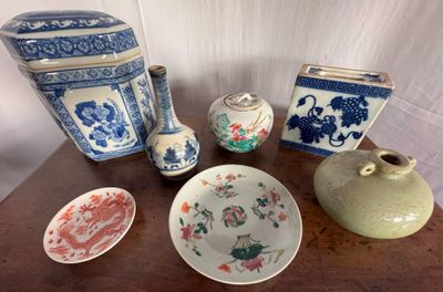 many different types of vases and bowls on the table