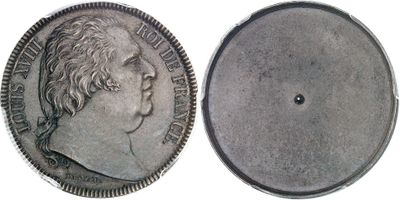a close up of a silver coin with a face of a man