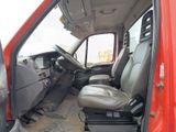 an image of a red truck with the driver ' s seat up