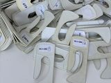 a pile of toilet seat covers on a white table