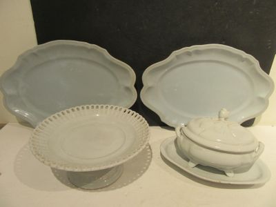 two plates and a bowl sitting on a table