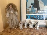 a picture of a collection of dolls and figurines on a table