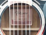 a close up of a guitar with a label on it