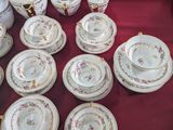 a table with a bunch of plates and cups on it
