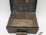 a box with tools and a ruler on a table