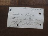 a piece of paper with writing on it sitting on a table
