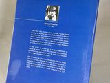 a blue book with a picture of a man on it