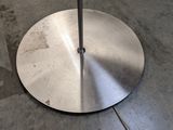 an image of a metal umbrella stand on the ground