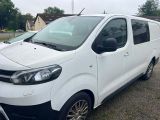 a picture of a white van parked on the side of the road