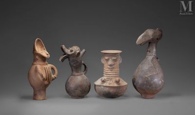 several different types of vases sitting on top of a gray surface