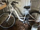 a bike that is leaning against a wall in a garage
