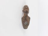 sculpture of a woman ' s head on a wall with a white background