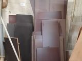 several pieces of wood are stacked on top of each other in a room