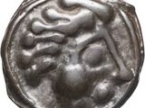 gros plan d'une pièce d'argent avec un visage dessus