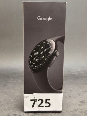 une image représentant un coffret pour une montre connectée, sur lequel figure une horloge