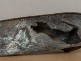 a metal sculpture of a horse that is on a table