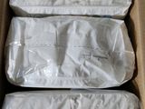 three bags of food are sitting in a box on a table