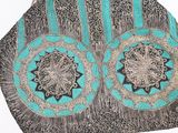 an image of a purse with a blue and black design
