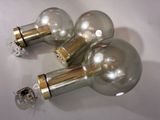 three light bulbs that are sitting on a table