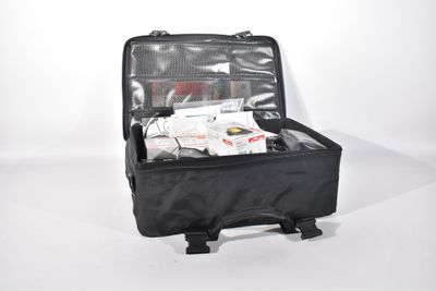 a black suitcase with a bunch of items inside of it