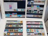 a lot of stamps on the back of a laptop