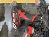 a cordless drill and a cordless drill on a table