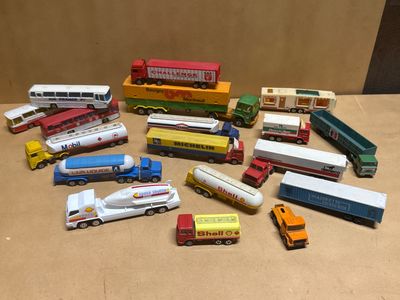 many different types of toy trucks and trucks on the table