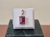 sterling silver ring with a square cut ruby stone set in a white box