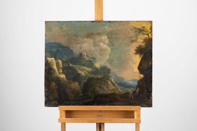 tableau posé sur un chevalet, avec un paysage de montagne en arrière-plan