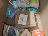a cardboard box with a bunch of items inside of it