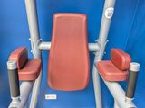 a red and silver gym equipment sitting on a blue surface