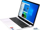 a laptop computer that is open on a white surface