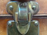 a close up of a metal latch on a suitcase