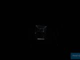 dark room with a small window and a small window in the middle