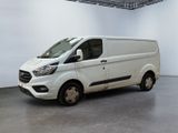 the white van is parked in a large white room