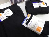 three pairs of men ' s black tights are on display at a store