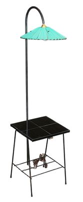 a black table with a green umbrella on it