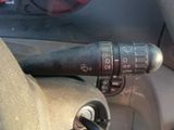a close up of a car ' s steering control knob