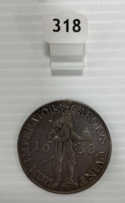 une vieille pièce de monnaie sur laquelle figure l'effigie d'une femme