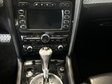 a picture of a car dashboard with a gear stick