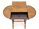a small table with a wooden top and two drawers
