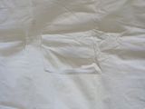 a white sheet with a hole in the middle of it