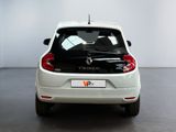 the back end of a white car parked in a showroom