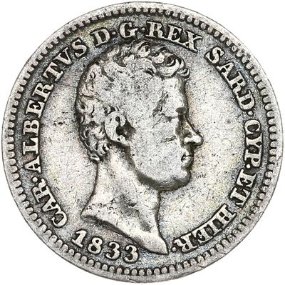 une pièce d'argent représentant la tête d'un homme de profil